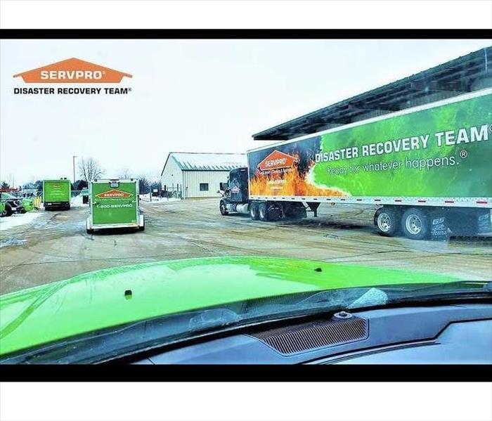 SERVPRO trucks outside of a commercial building